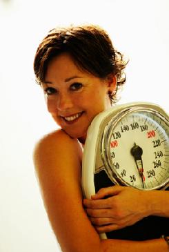 happy woman who lost weight with hypnosis